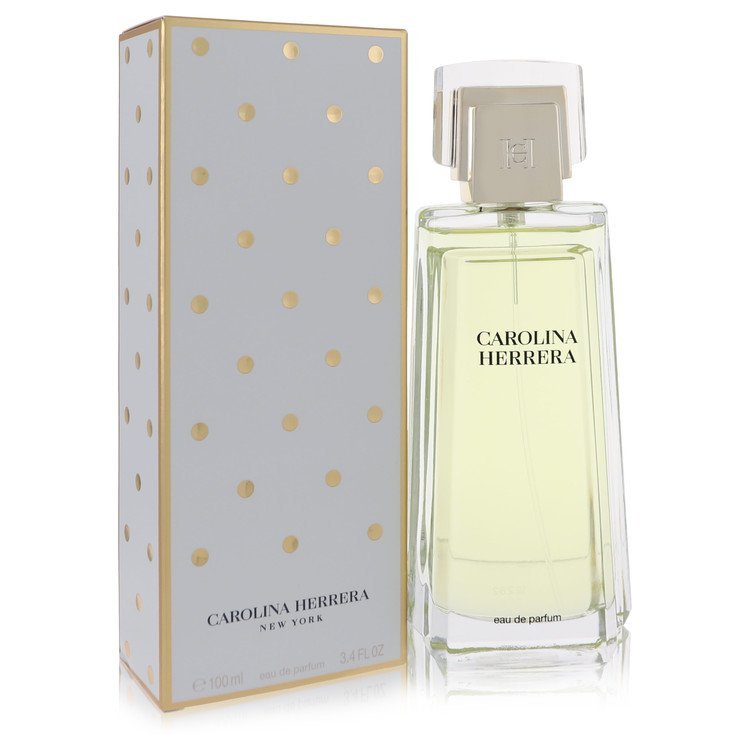 Carolina Herrera Eau De Parfum Spray 3.4 oz bottle and white box with gold polka dots